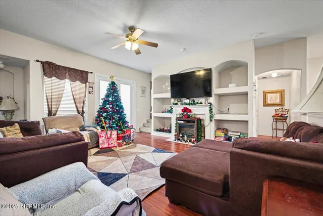 a living room with furniture and a flat screen tv