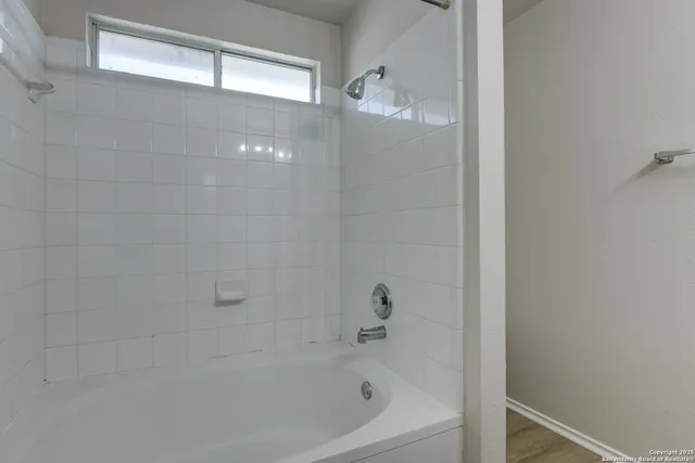 a close up of a bathtub in a bathroom