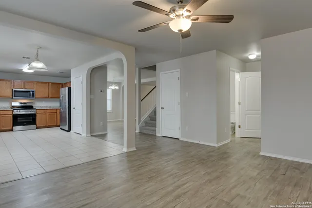 a view of a kitchen with a sink and a kitchen area