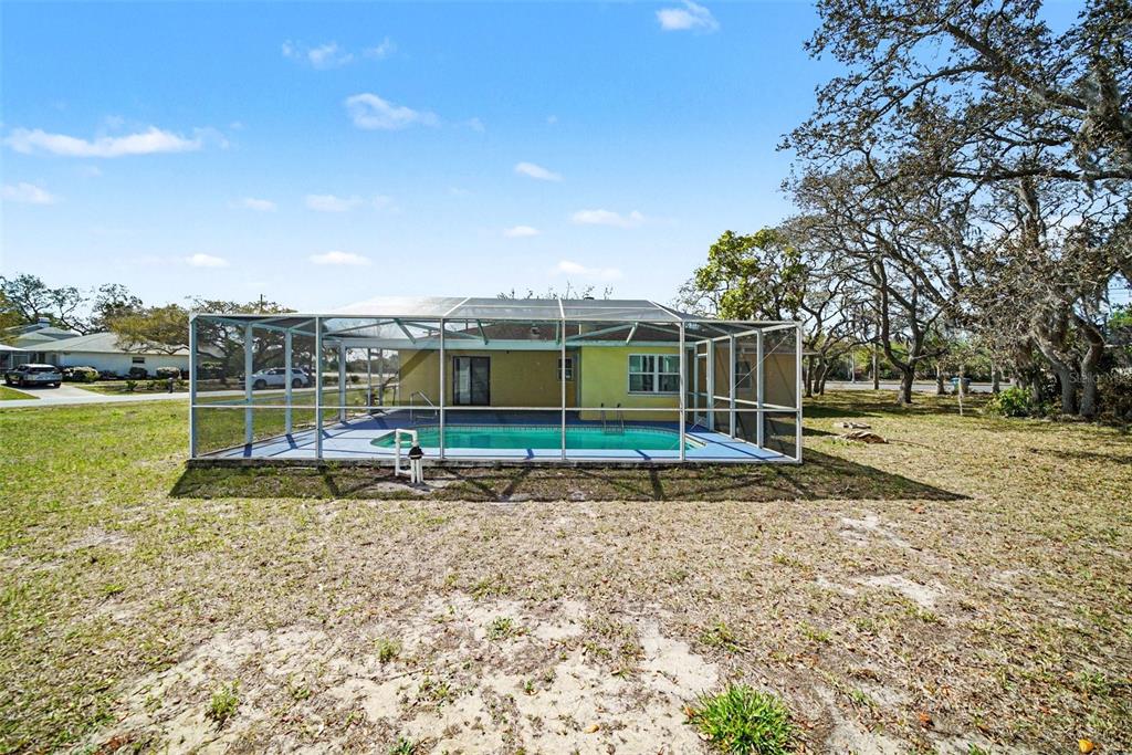 113 Ruskin Avenue Spring Hill, FL 34606 - Photo 30 of 32 a view of a house with a yard
