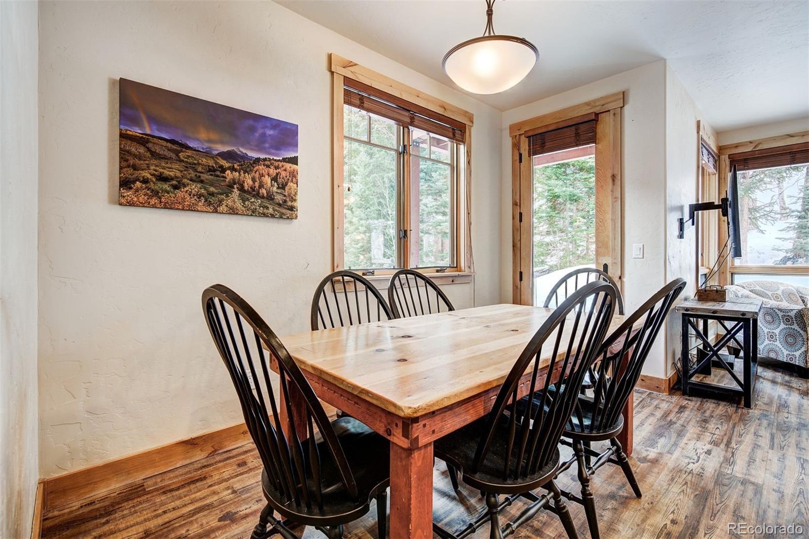 35 Tip Top Trail, Unit 6500 Keystone, CO 80435 - Photo 11 of 24 a view of a dining room with furniture window and wooden floor