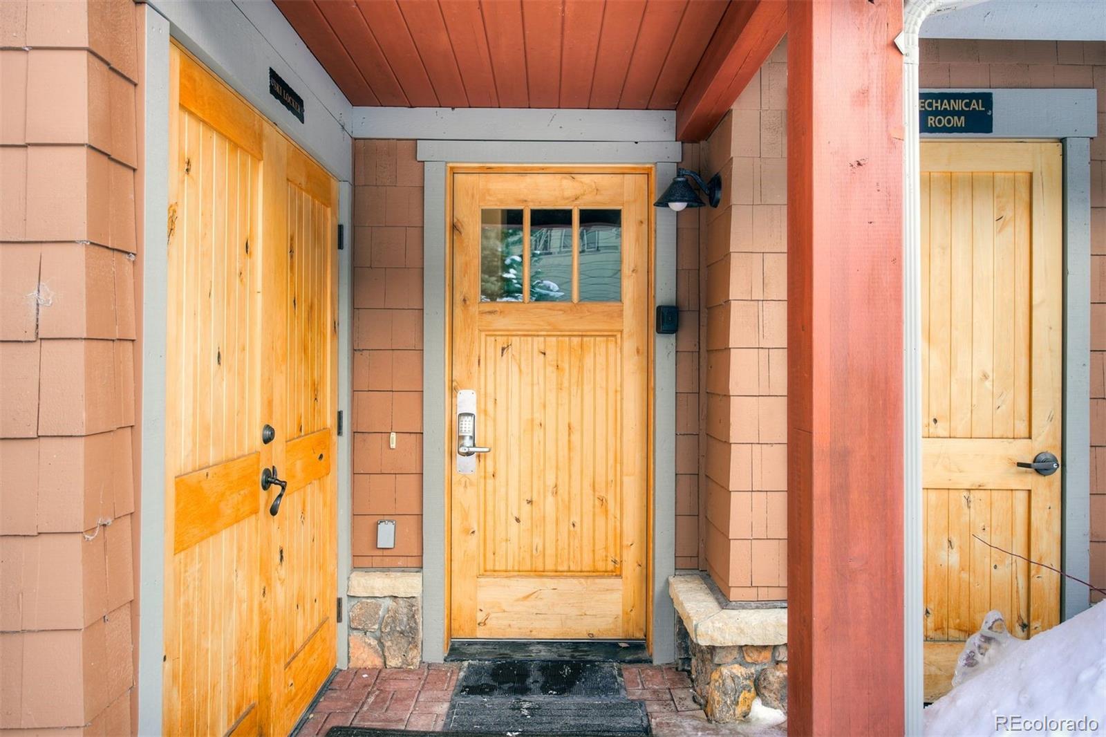 35 Tip Top Trail, Unit 6500 Keystone, CO 80435 - Photo 21 of 24 a view of a bathroom with a door and wooden door