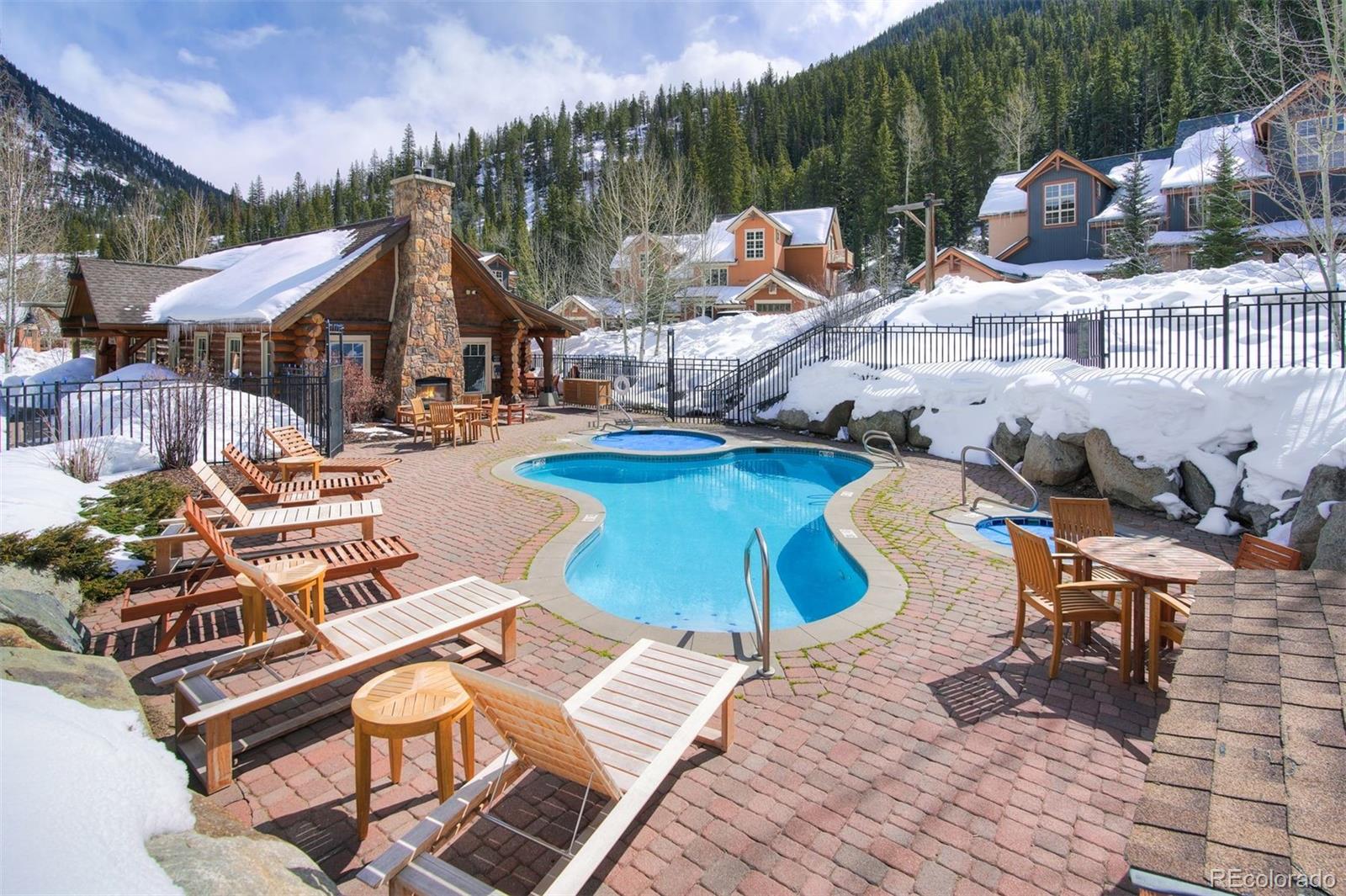 35 Tip Top Trail, Unit 6500 Keystone, CO 80435 - Photo 22 of 24 a view of a patio with table and chairs potted plants with wooden floor
