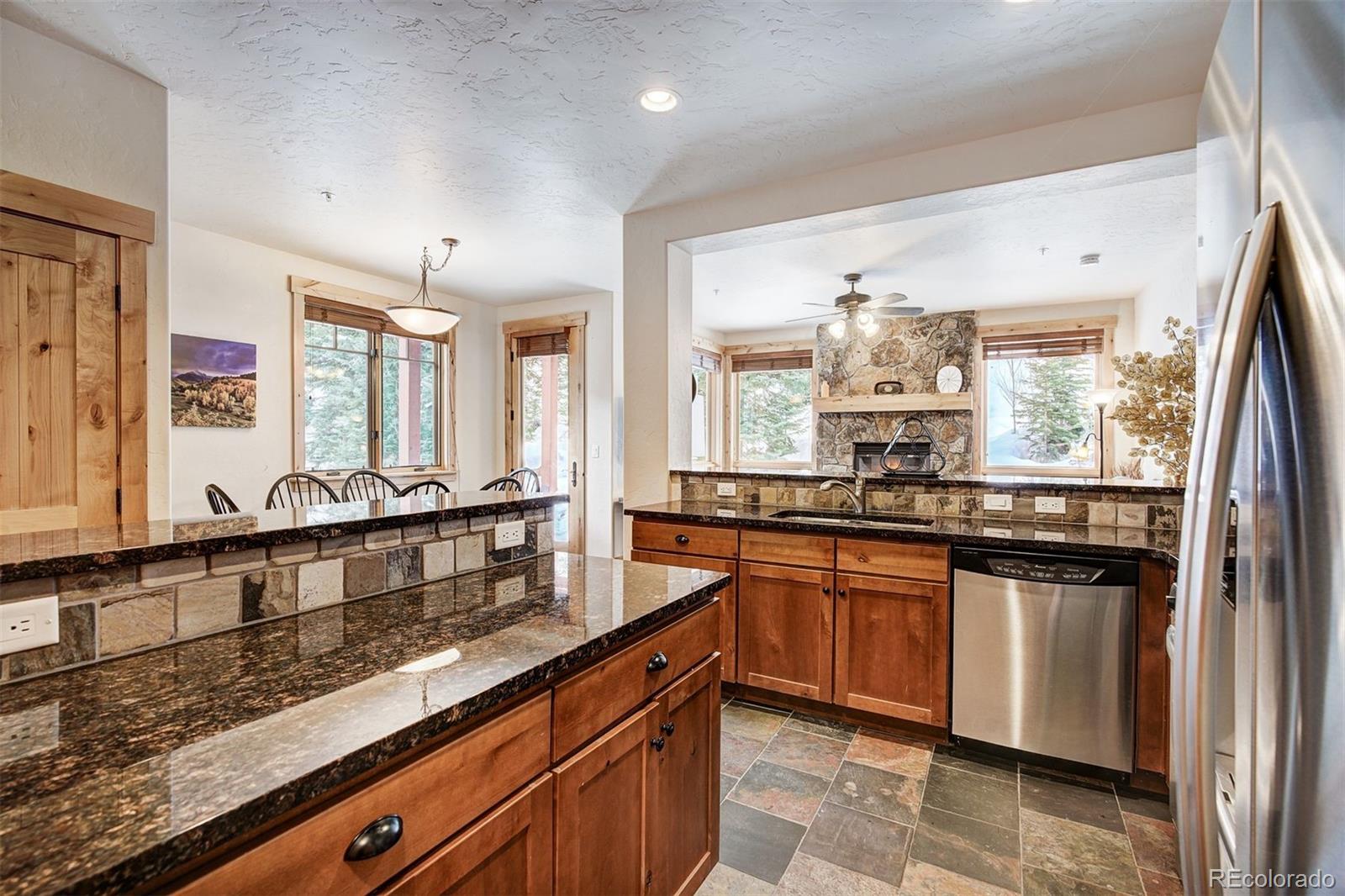 35 Tip Top Trail, Unit 6500 Keystone, CO 80435 - Photo 7 of 24 a large kitchen with granite countertop lots of counter space and sink