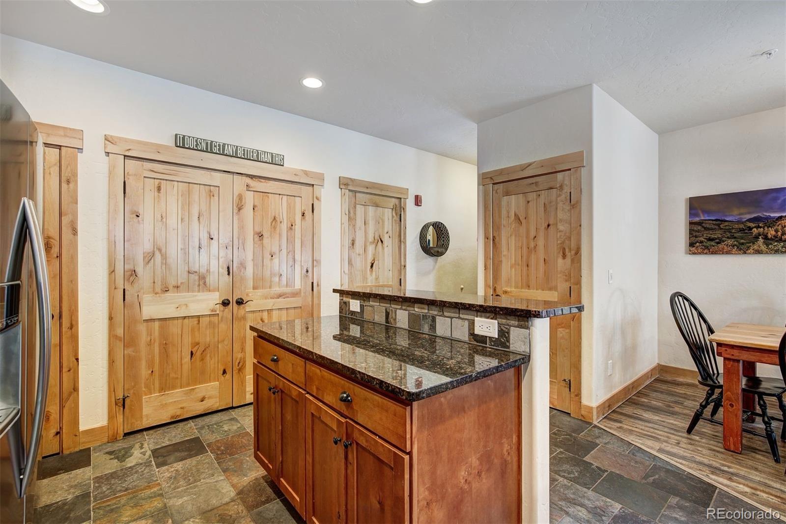35 Tip Top Trail, Unit 6500 Keystone, CO 80435 - Photo 9 of 24 a kitchen with stainless steel appliances granite countertop a stove and a refrigerator