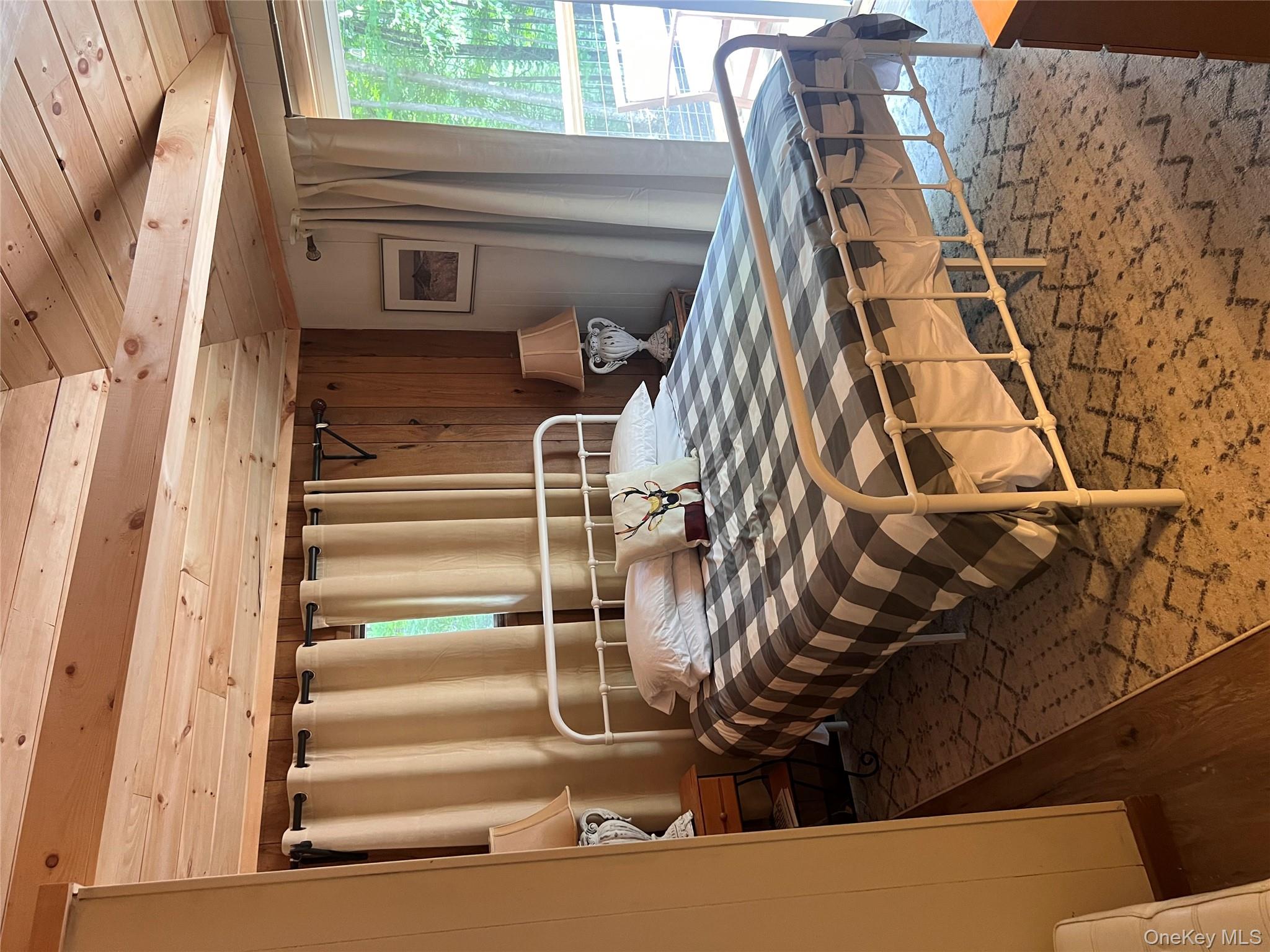 2446 Ulster Heights Road Woodbourne, NY 12788 - Photo 11 of 19 a bedroom with a bed and a table