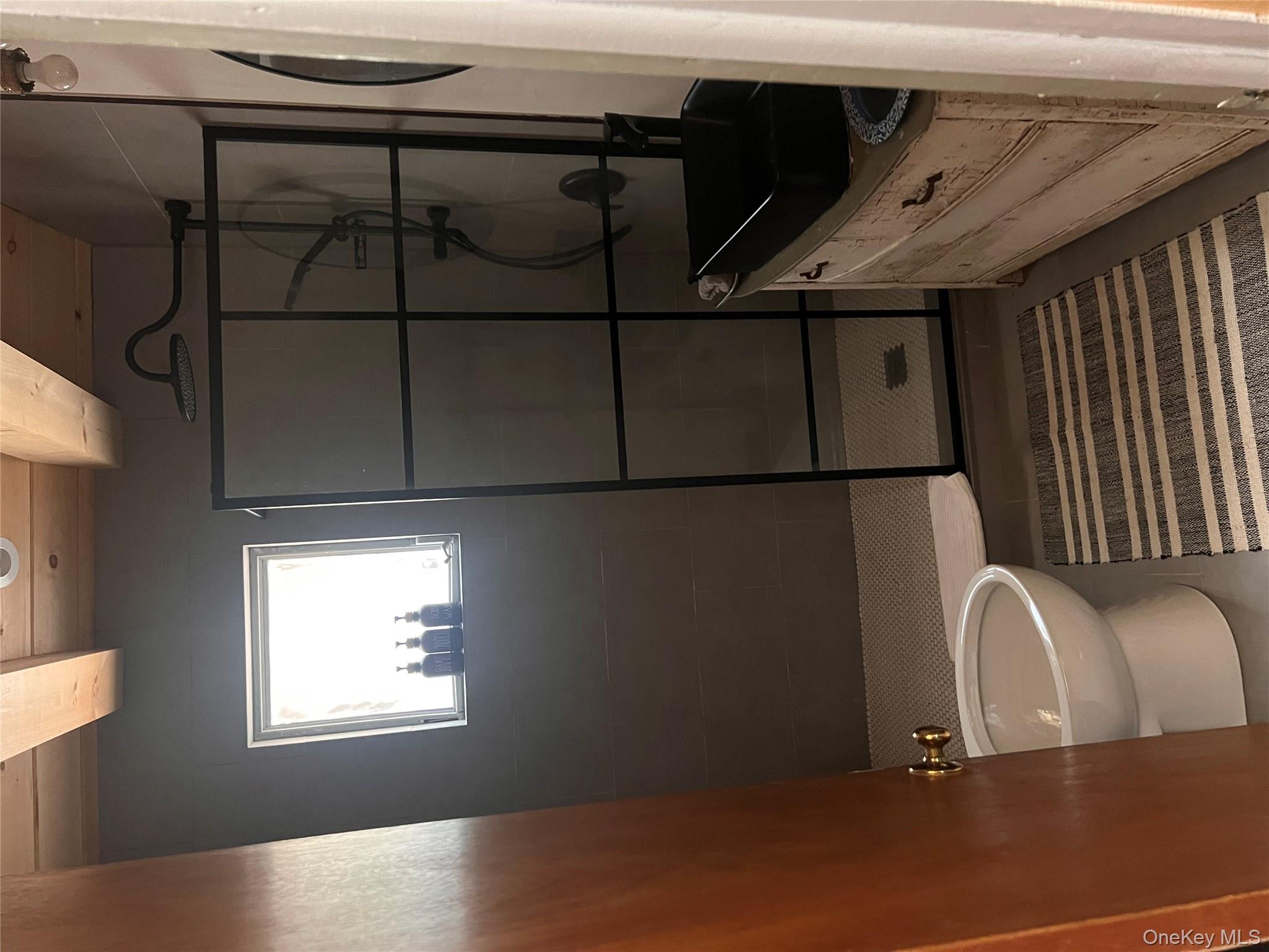 2446 Ulster Heights Road Woodbourne, NY 12788 - Photo 12 of 19 a bathroom with a granite countertop bathtub shower sink vanity and toilet