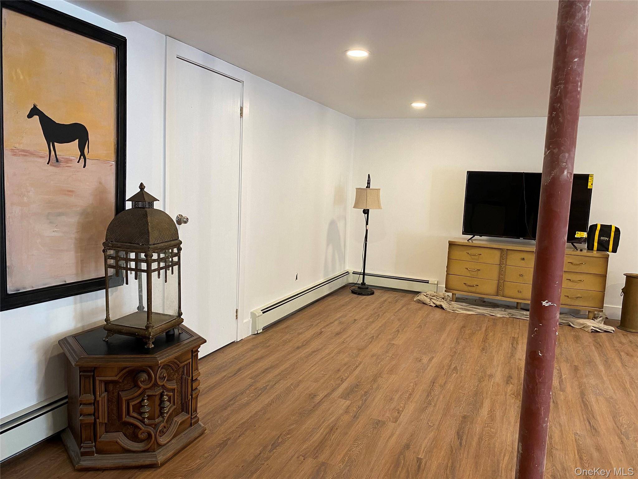 2446 Ulster Heights Road Woodbourne, NY 12788 - Photo 15 of 19 a view of a workspace with wooden floor