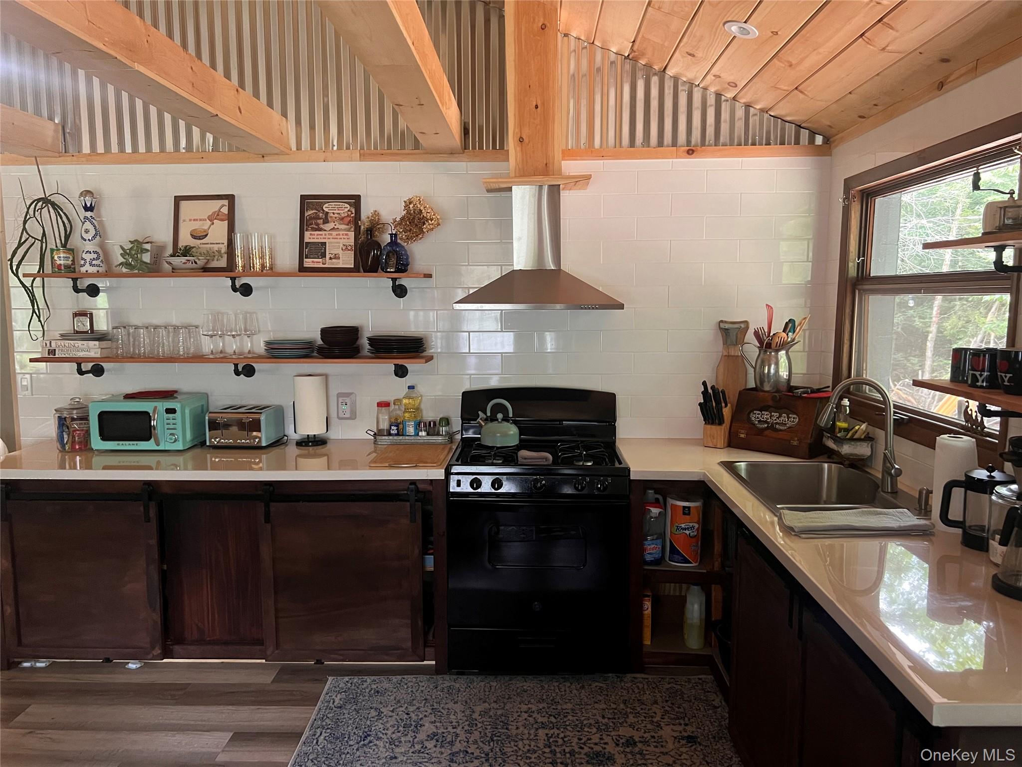 2446 Ulster Heights Road Woodbourne, NY 12788 - Photo 8 of 19 a kitchen with stainless steel appliances granite countertop a sink stove and cabinets