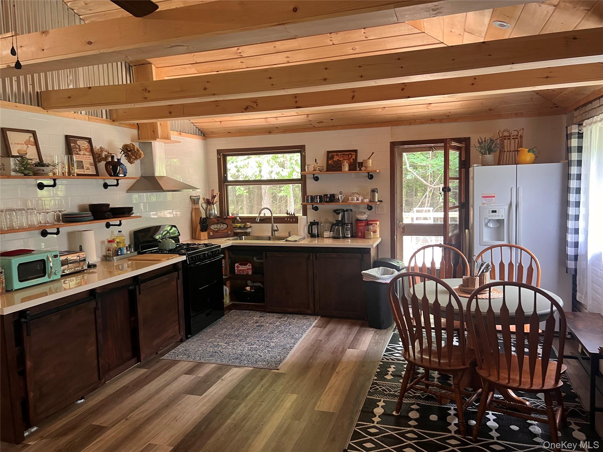 2446 Ulster Heights Road Woodbourne, NY 12788 - Photo 9 of 19 a kitchen with stainless steel appliances granite countertop a sink stove and cabinets