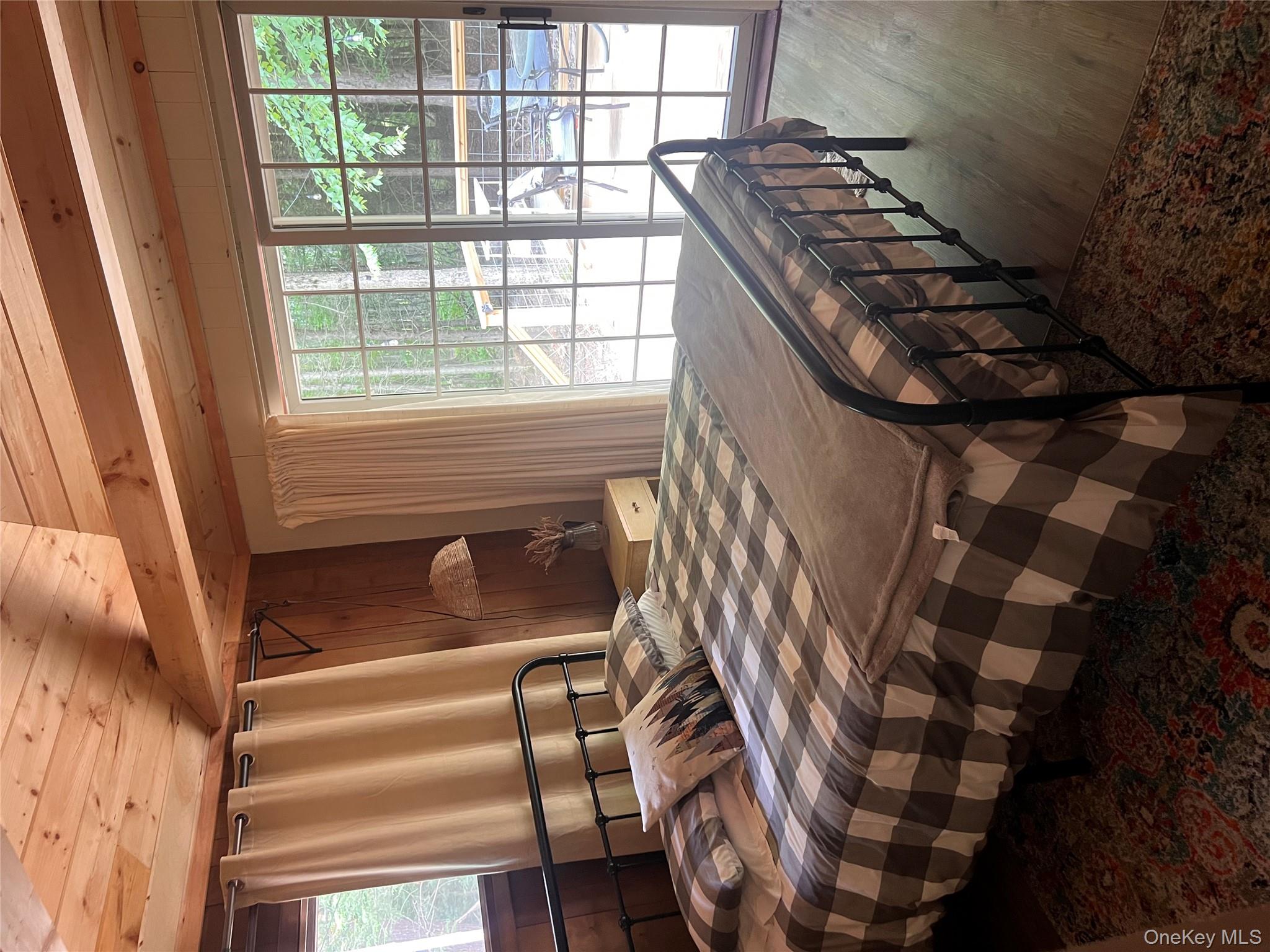 2446 Ulster Heights Road Woodbourne, NY 12788 - Photo 10 of 19 a bedroom with a bed a table and chair