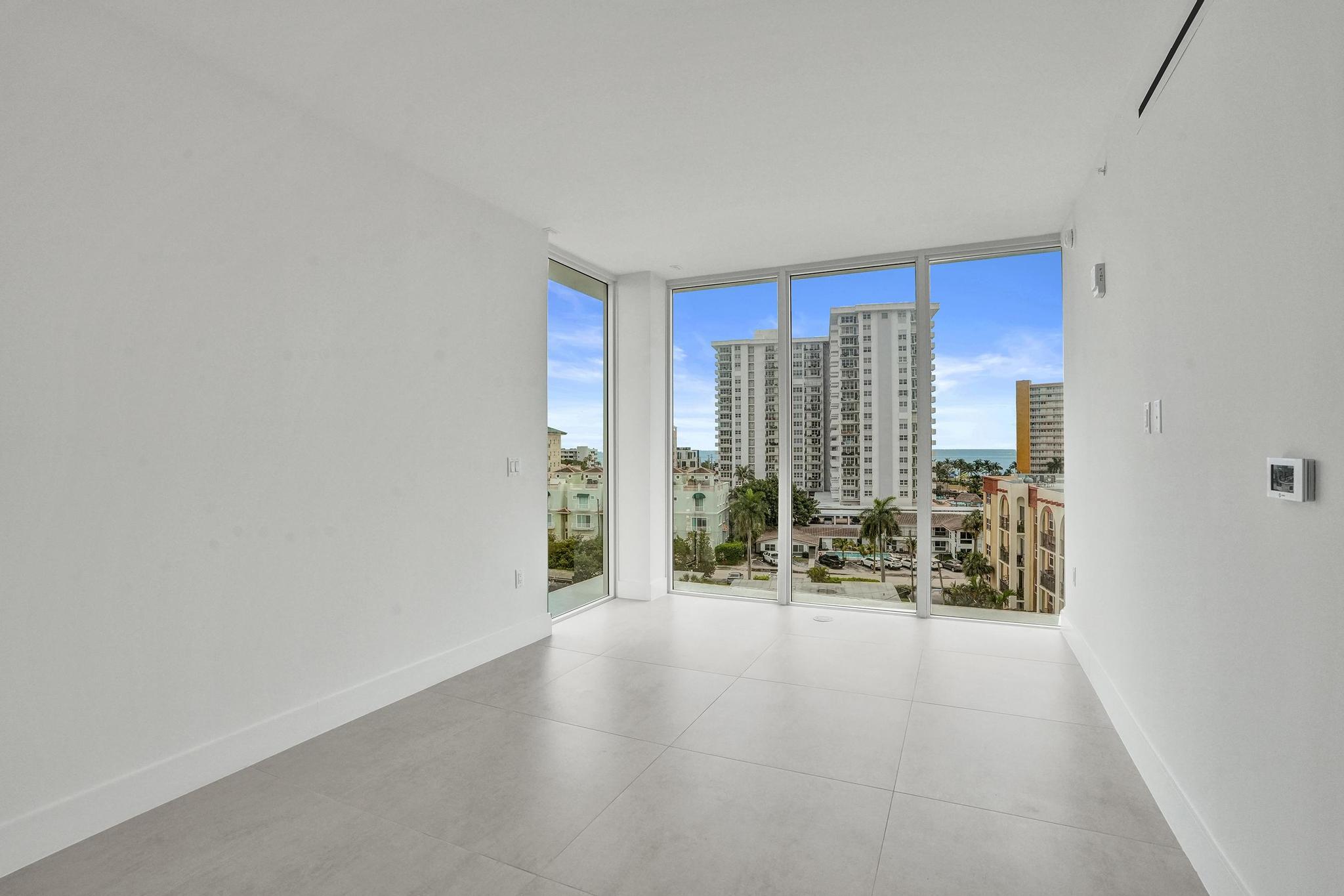 407 North Riverside Drive, Unit 605 Pompano Beach, FL 33062 - Photo 19 of 93 a view of room with floor to ceiling window