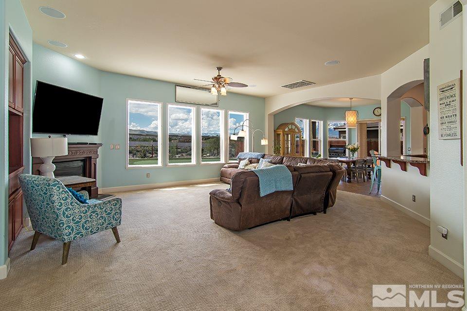 2630 Trail Rider Drive Reno, NV 89521 - Photo 3 of 25 a living room with furniture windows and a flat screen tv