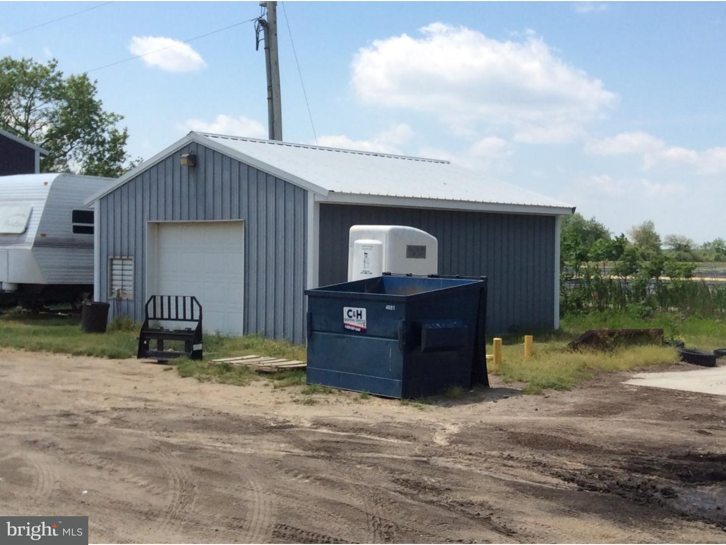 126 Sunset Drive Mannington, NJ 08079 - Photo 13 of 25 a view of a house wooden deck and a yard