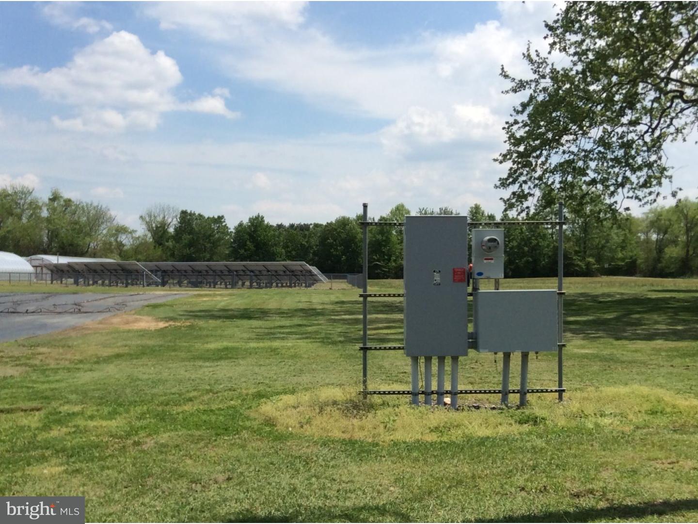 126 Sunset Drive Mannington, NJ 08079 - Photo 23 of 25 a view of a table and chairs in the lake