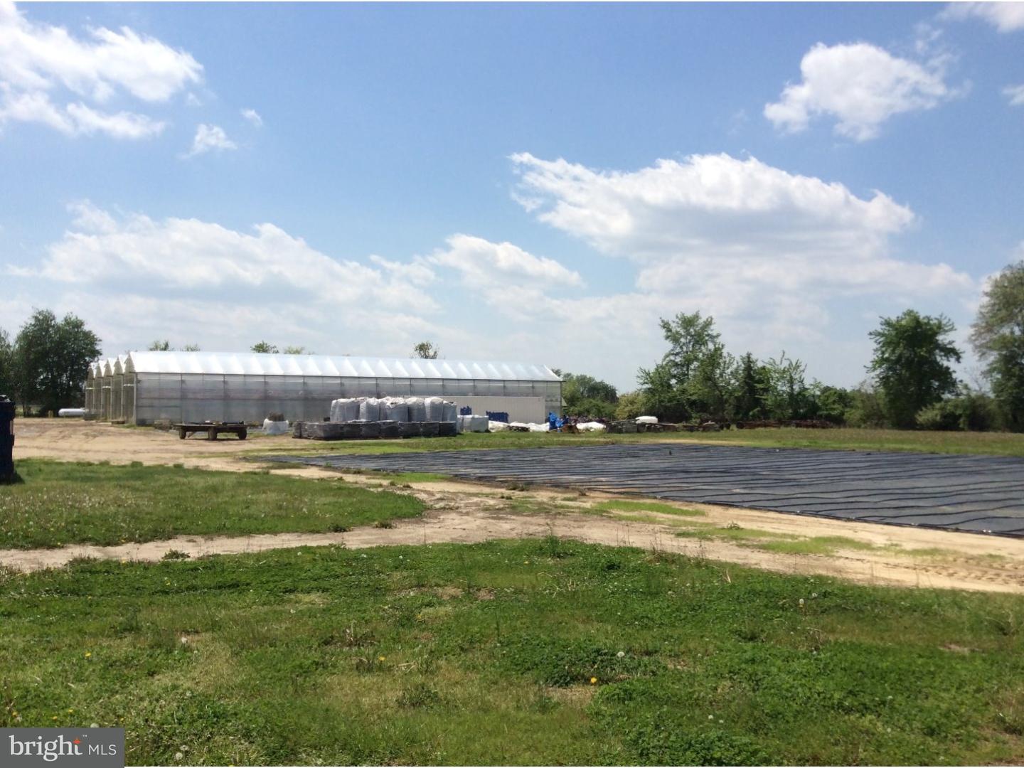 126 Sunset Drive Mannington, NJ 08079 - Photo 5 of 25 a view of a swimming pool is middle in the garden