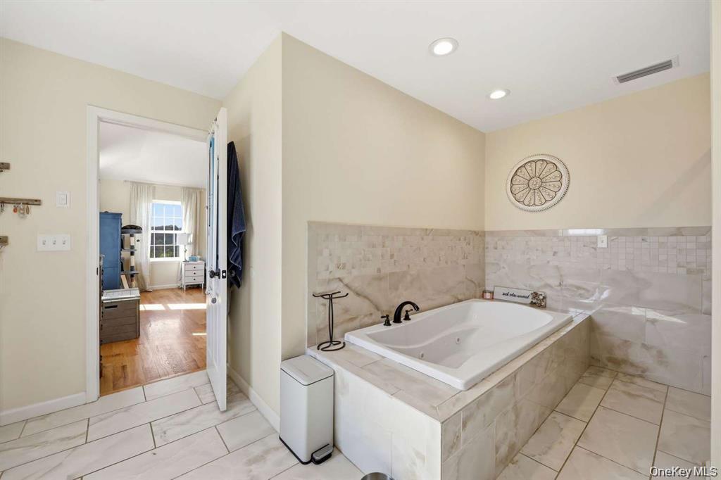 133 Old Chester Road Goshen, NY 10924 - Photo 19 of 33 a bathroom with a sink a toilet and a shower