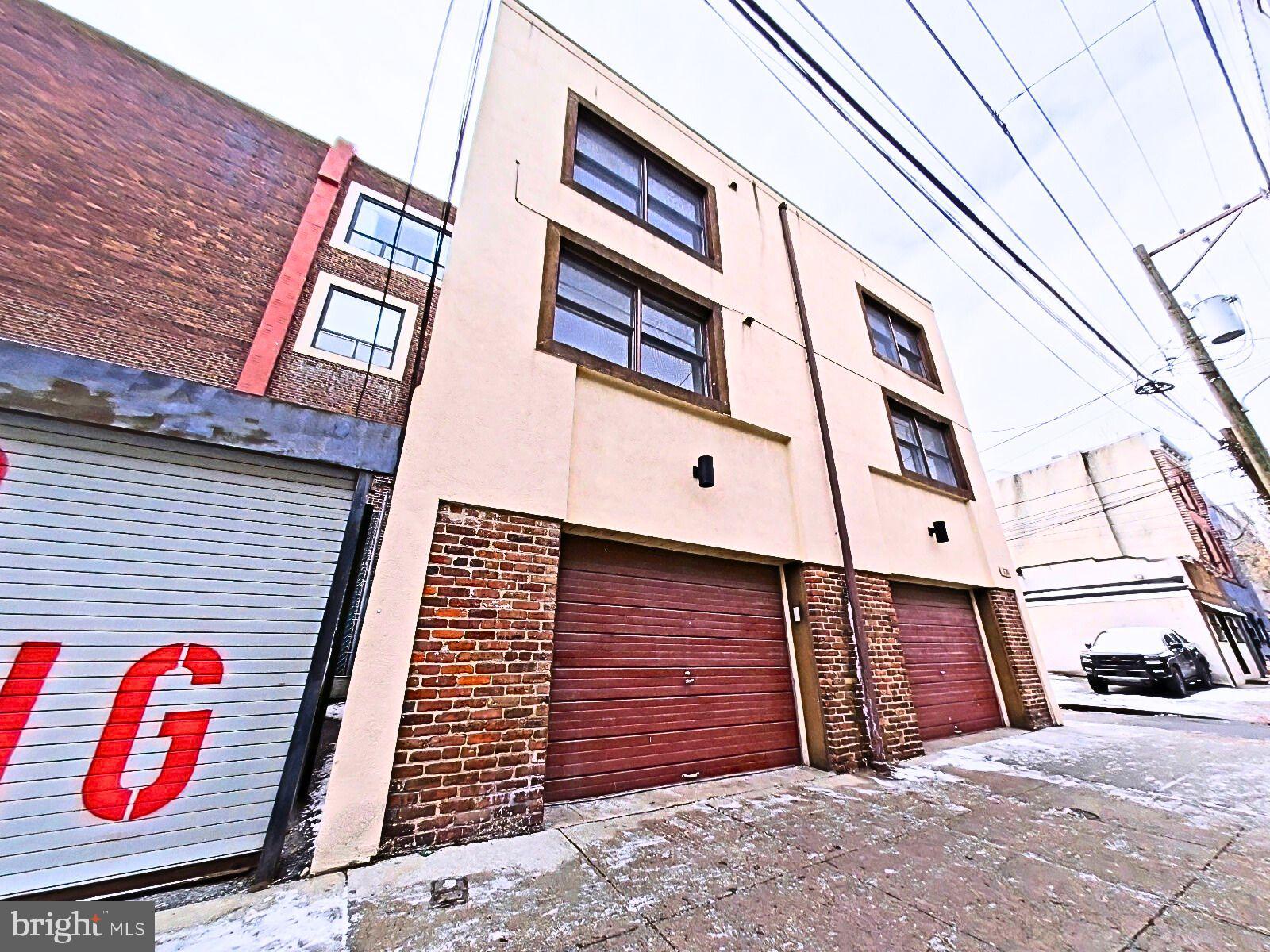 610-12 Bainbridge Street, Unit 2 Philadelphia, PA 19147 - Photo 22 of 23 a front view of building with parking space