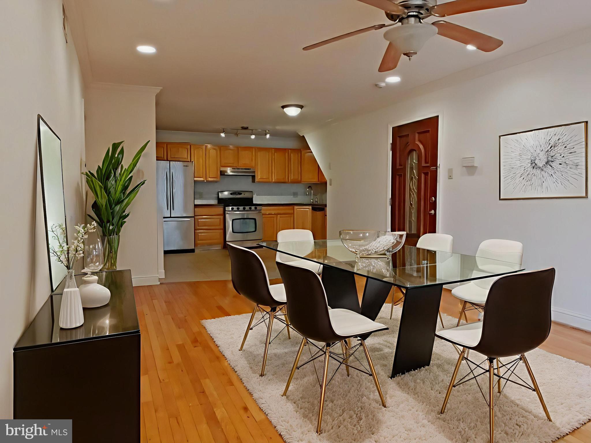 610-12 Bainbridge Street, Unit 2 Philadelphia, PA 19147 - Photo 3 of 23 a view of a dining room with furniture and wooden floor