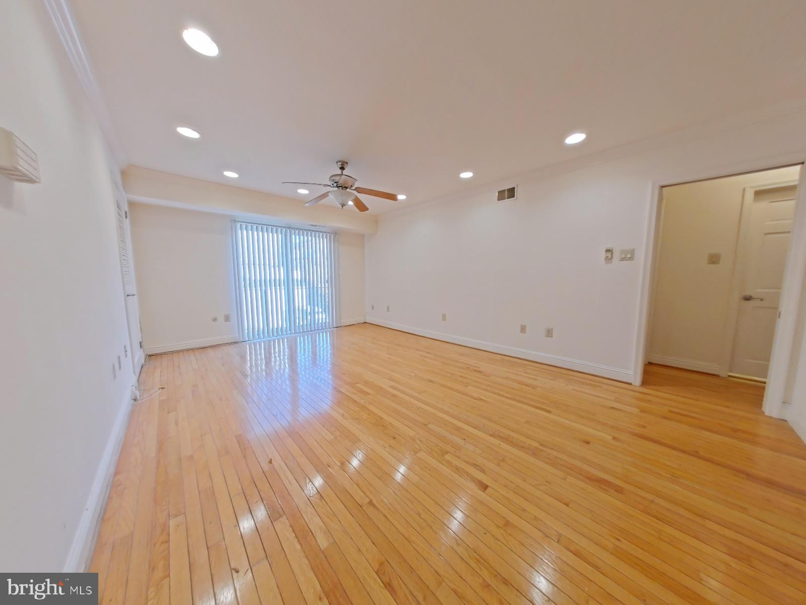 610-12 Bainbridge Street, Unit 2 Philadelphia, PA 19147 - Photo 7 of 23 a view of an empty room with wooden floor