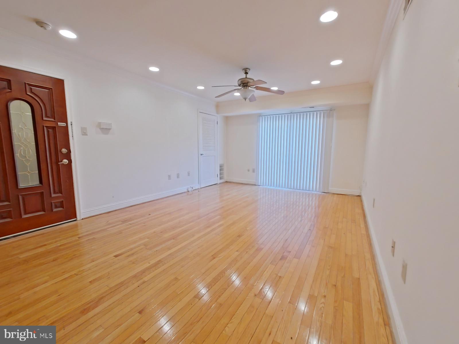 610-12 Bainbridge Street, Unit 2 Philadelphia, PA 19147 - Photo 8 of 23 wooden floor in an empty room with a window