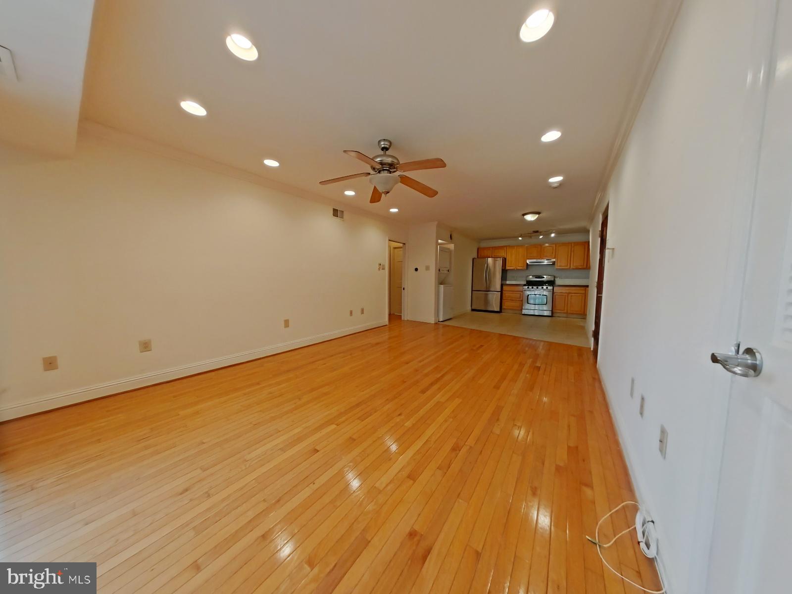 610-12 Bainbridge Street, Unit 2 Philadelphia, PA 19147 - Photo 9 of 23 wooden floor in an empty room with a window
