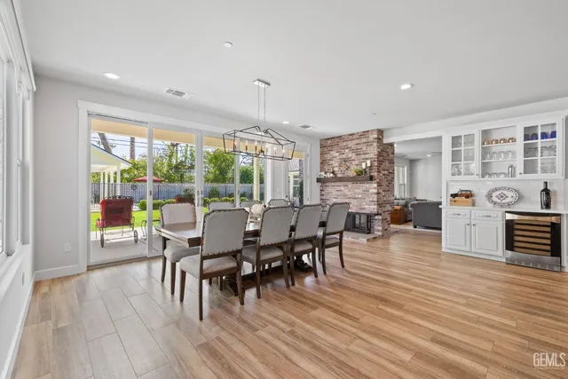 a bathroom with a granite countertop sink a mirror and a bathtub