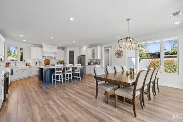 a bathroom with a tub sink and large window
