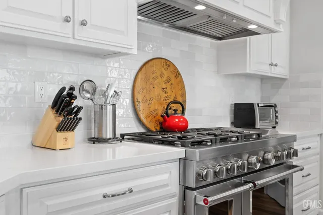 a spacious bedroom with a large bed and a fireplace