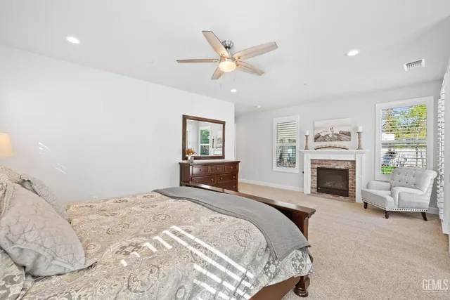 a view of a backyard with a patio and outdoor seating