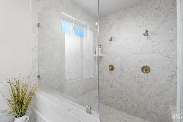 a view of a backyard with grass and wooden fence