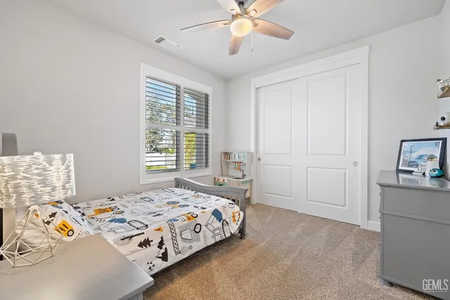 a bathroom with a shower a toilet and a sink
