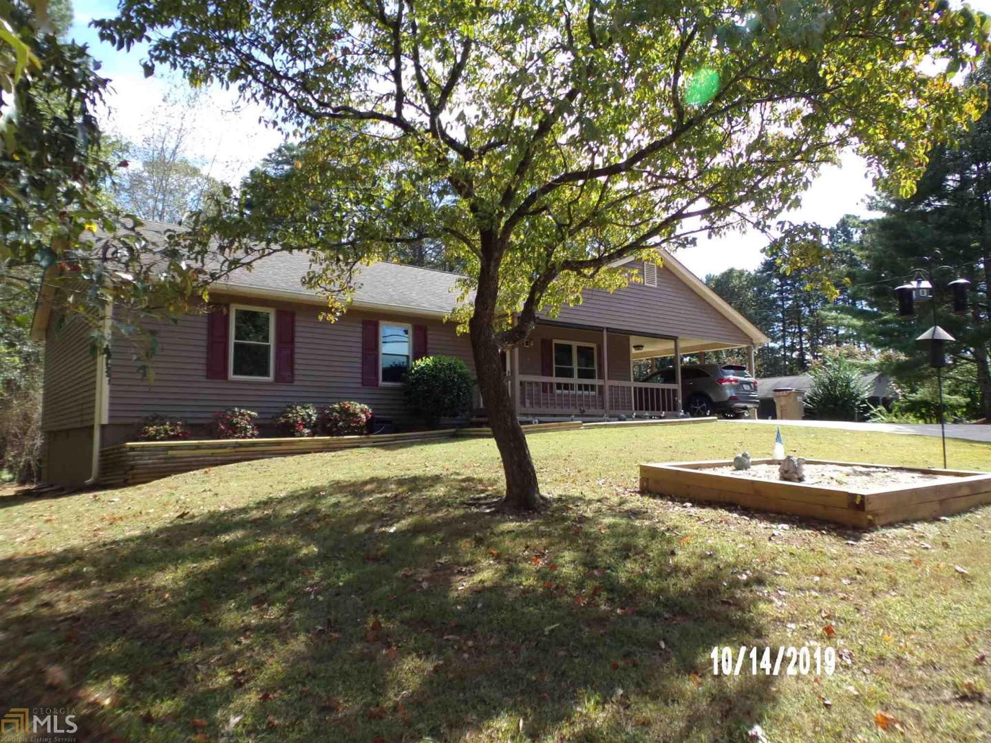 3635 Sinclair Shores Road, Unit 1 Cumming, GA 30041 - Photo 1 of 1 a front view of a house with a yard