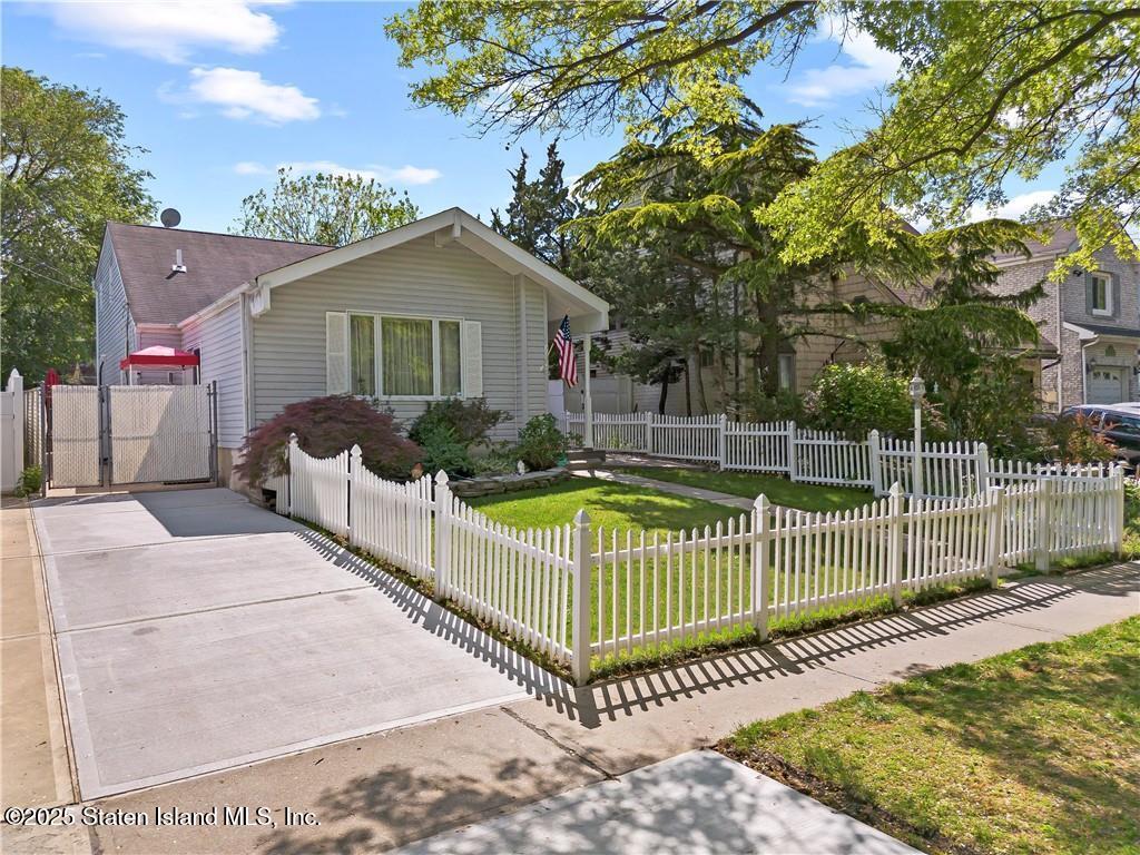 1182 Arthur Kill Road Staten Island, NY 10312 - Photo 3 of 3 a view of a deck with a small yard and plants