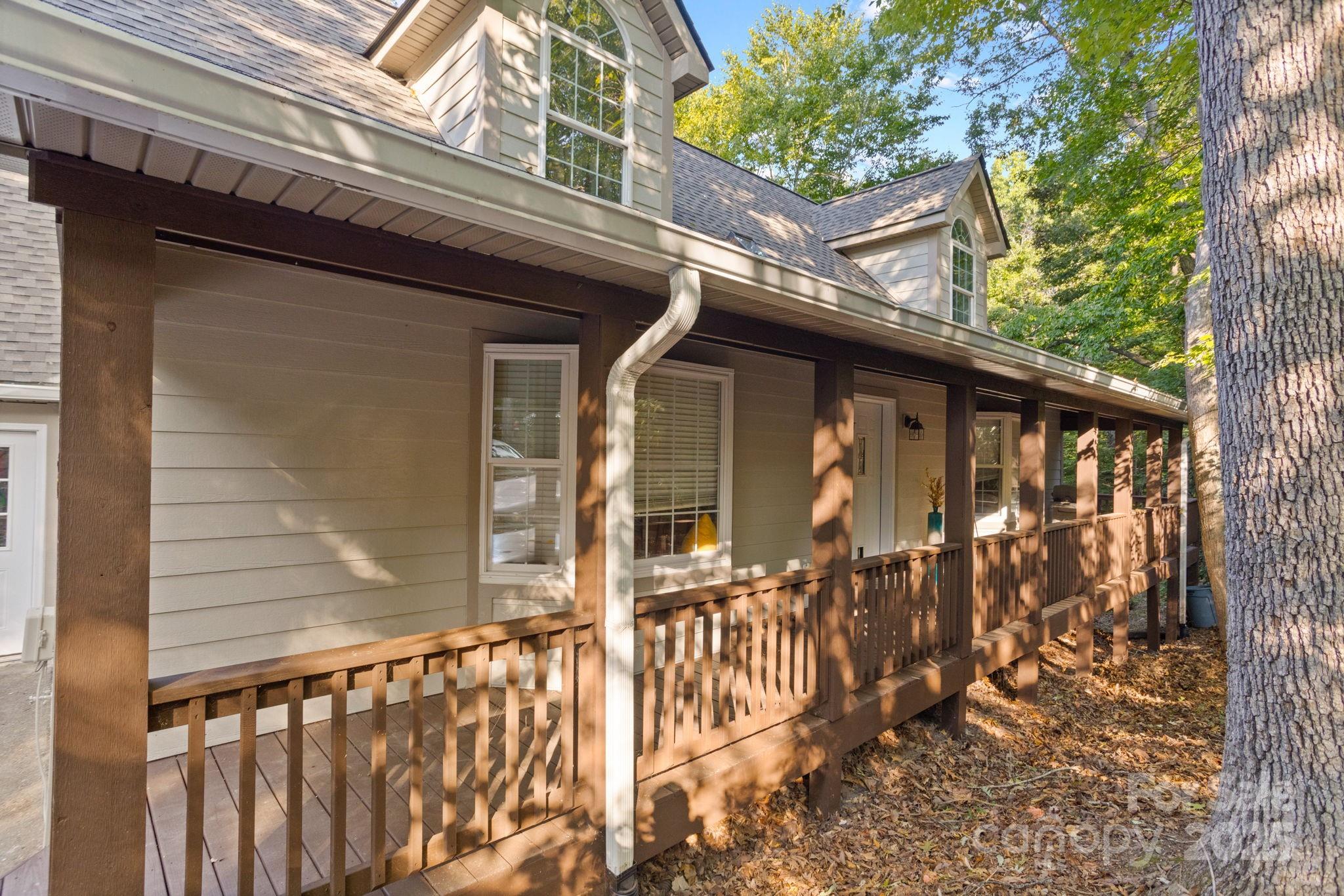 55 Vintage Road Candler, NC 28715 - Photo 2 of 47 a front view of a house with a porch