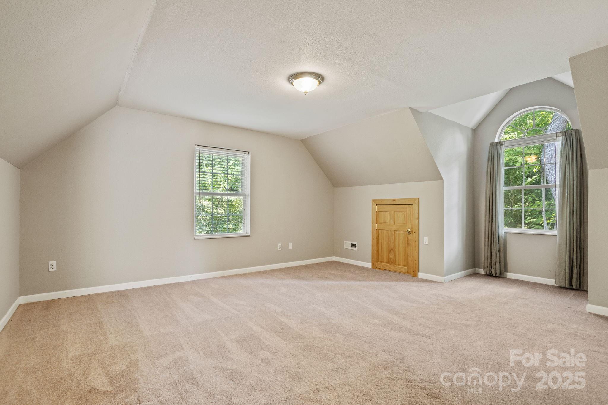 55 Vintage Road Candler, NC 28715 - Photo 23 of 47 a view of an empty room with a window