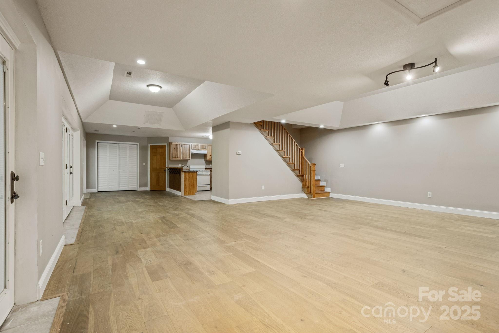 55 Vintage Road Candler, NC 28715 - Photo 29 of 47 an empty room with wooden cabinet and windows