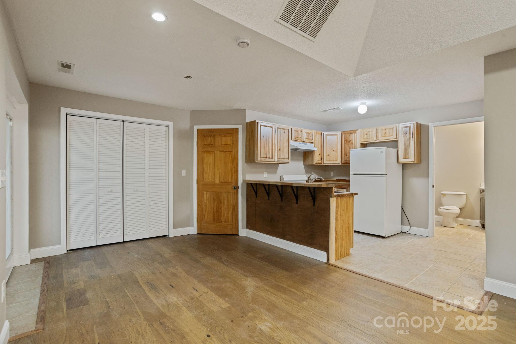 55 Vintage Road Candler, NC 28715 - Photo 32 of 47 a kitchen with stainless steel appliances a refrigerator and a stove