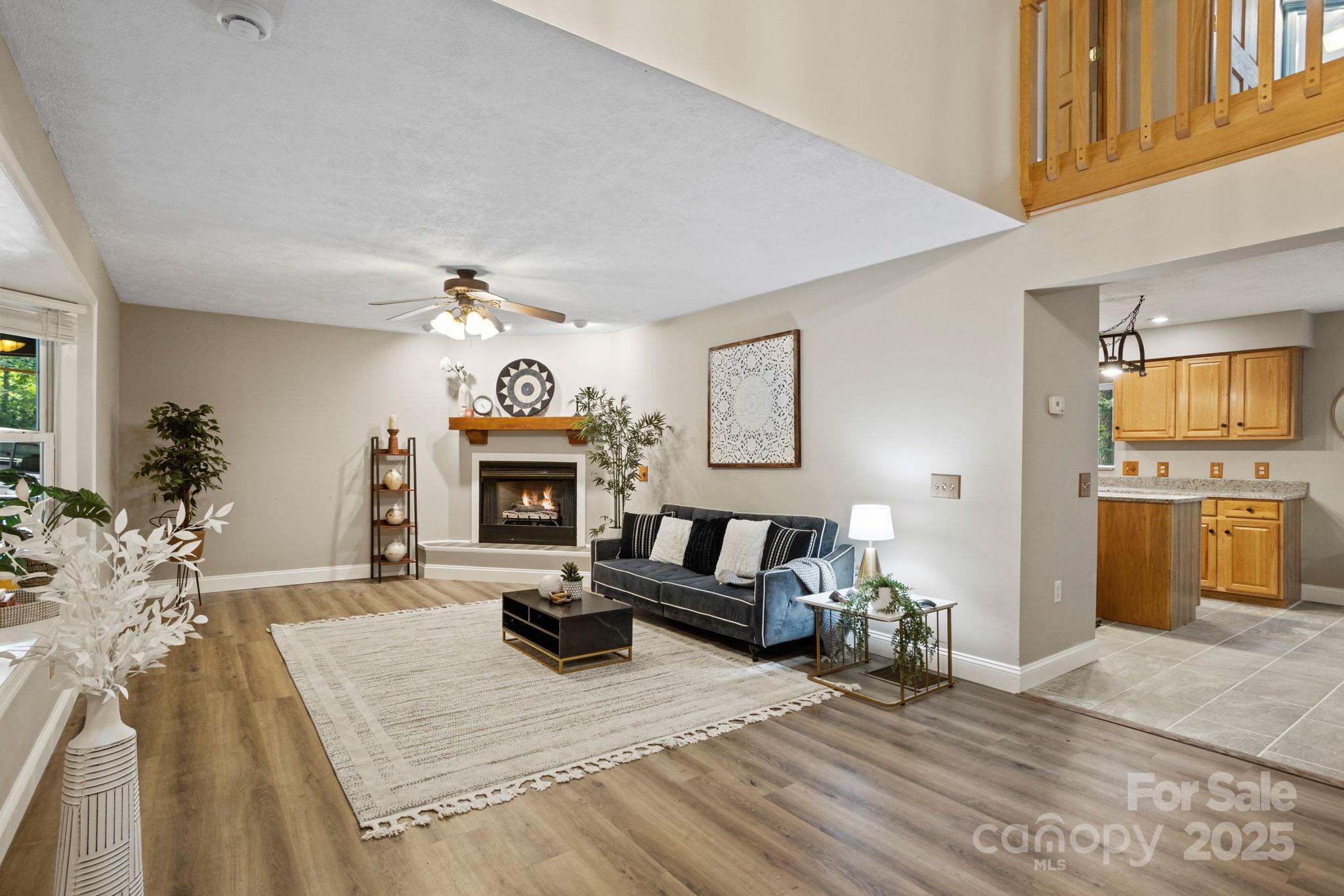 55 Vintage Road Candler, NC 28715 - Photo 5 of 47 a living room with furniture and a fireplace