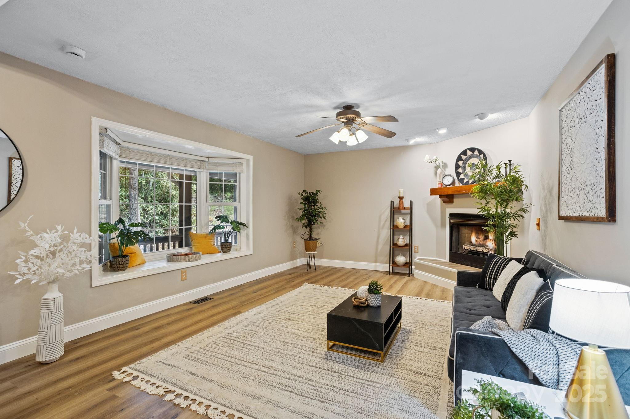 55 Vintage Road Candler, NC 28715 - Photo 6 of 47 a living room with furniture and a fireplace