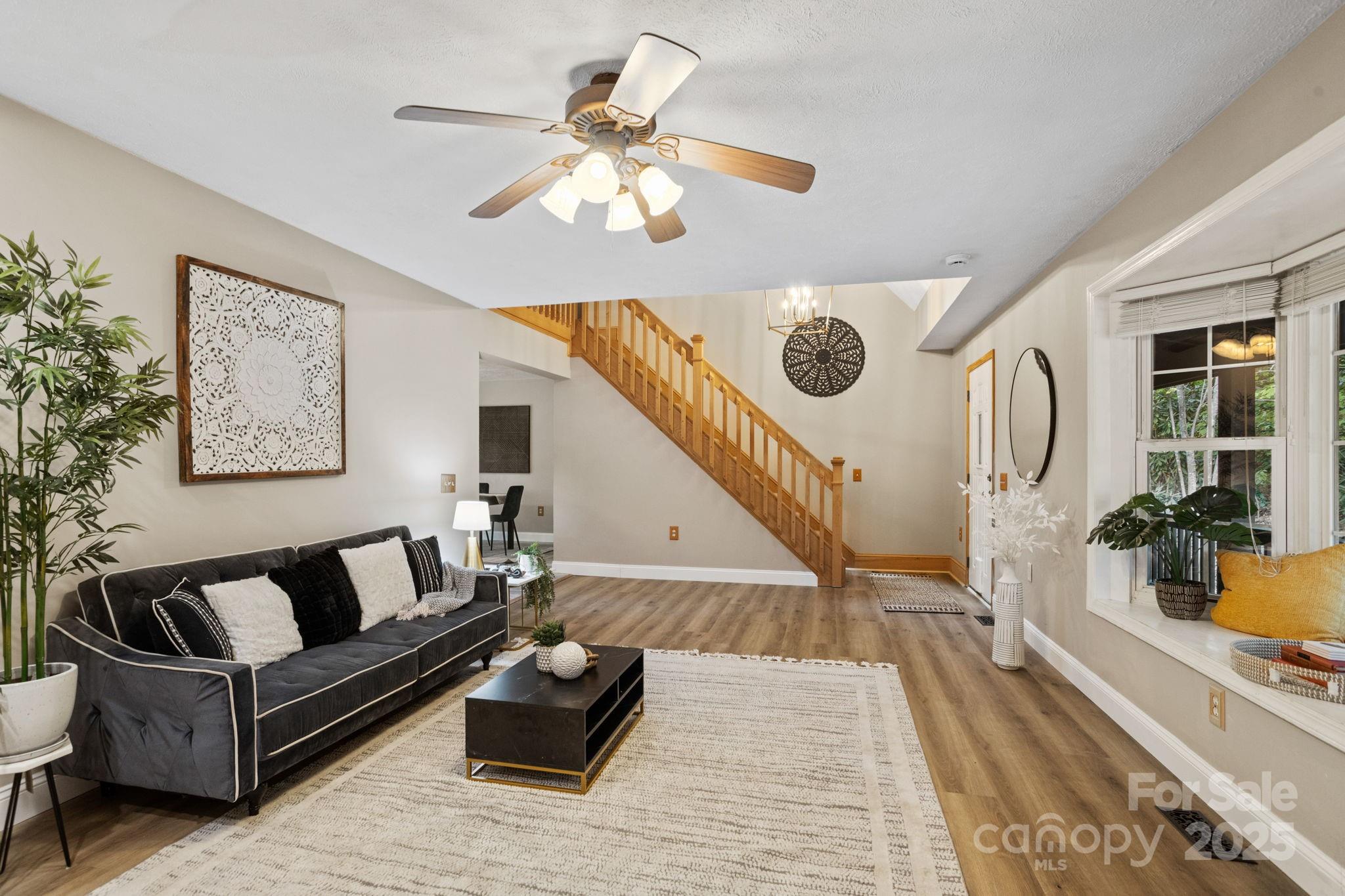 55 Vintage Road Candler, NC 28715 - Photo 7 of 47 a living room with furniture and a wooden floor