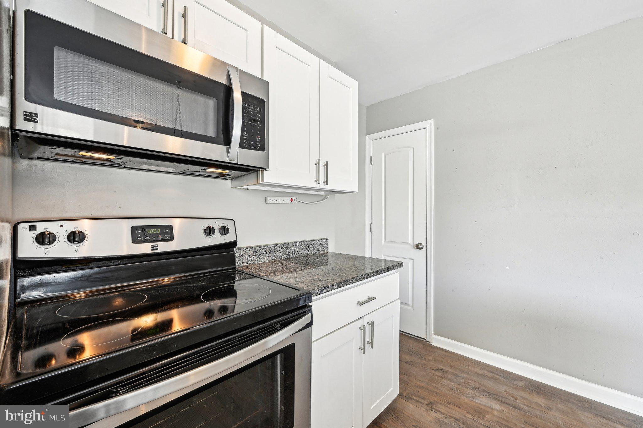 11 Kinship Road Dundalk, MD 21222 - Photo 15 of 46 a kitchen with a stove and a microwave