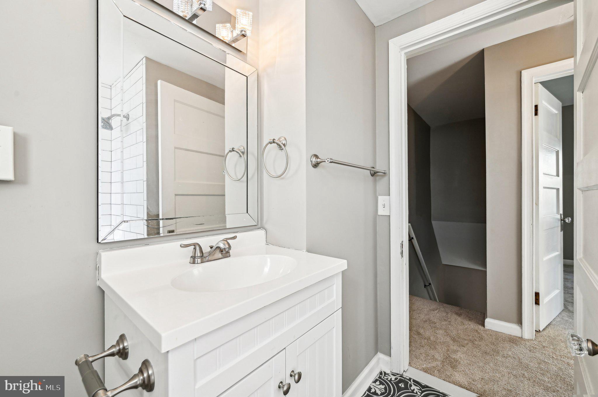11 Kinship Road Dundalk, MD 21222 - Photo 23 of 46 a bathroom with a sink and a mirror
