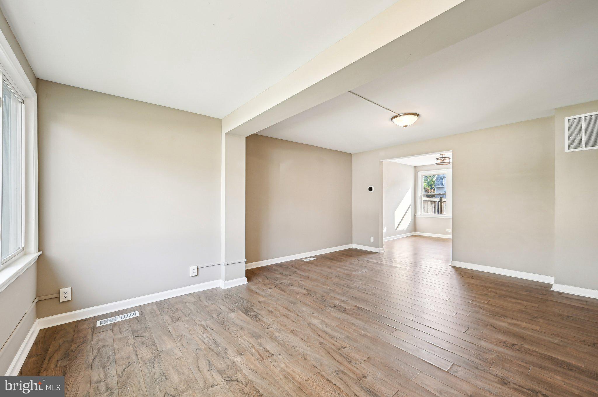 11 Kinship Road Dundalk, MD 21222 - Photo 5 of 46 a view of an empty room with wooden floor and a window