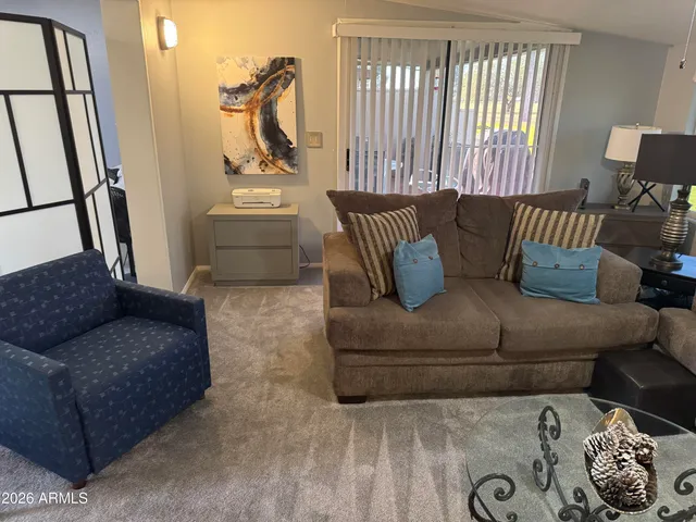 a living room with furniture and a window