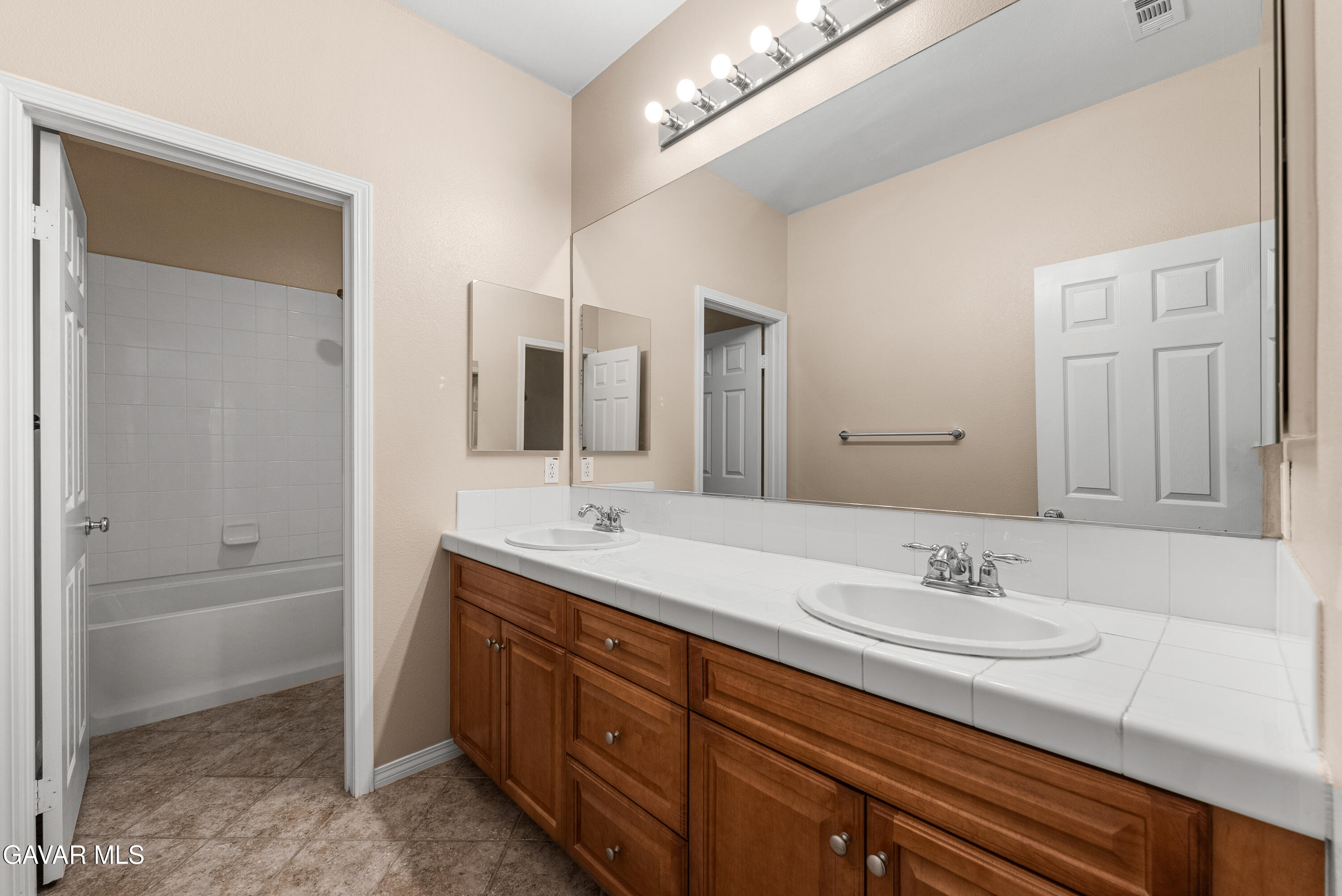 3724 Neola Way Lancaster, CA 93536 - Photo 18 of 31 a bathroom with a granite countertop sink mirror and double