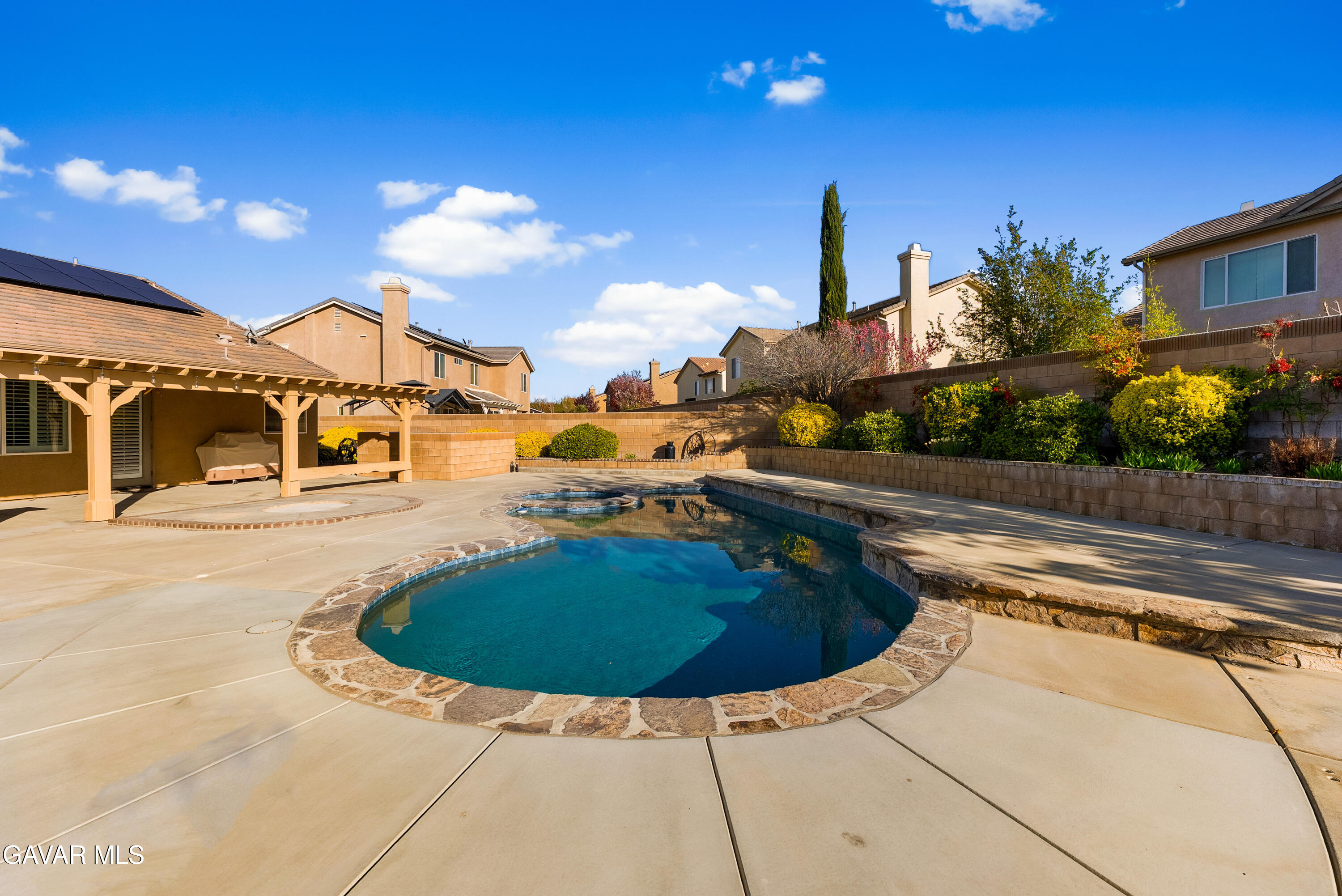 3724 Neola Way Lancaster, CA 93536 - Photo 24 of 31 a view of a swimming pool with a chair and tables