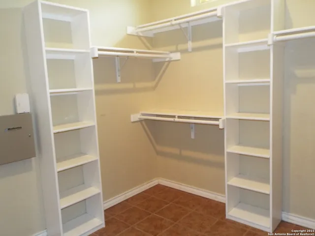 a view of an empty walk in closet