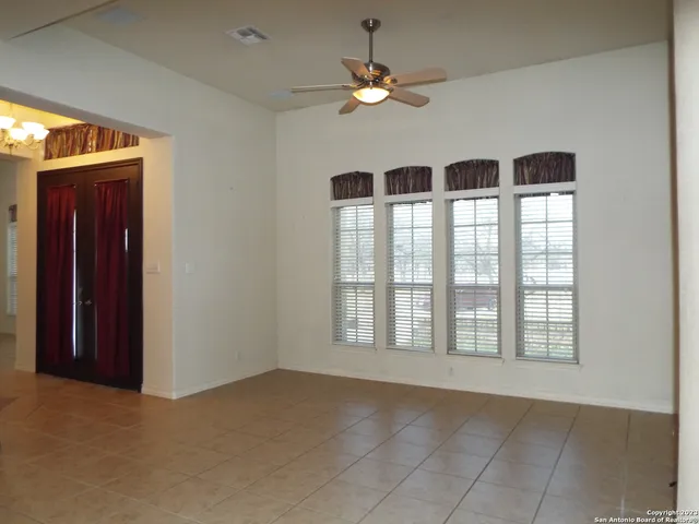 a view of an empty room with a window