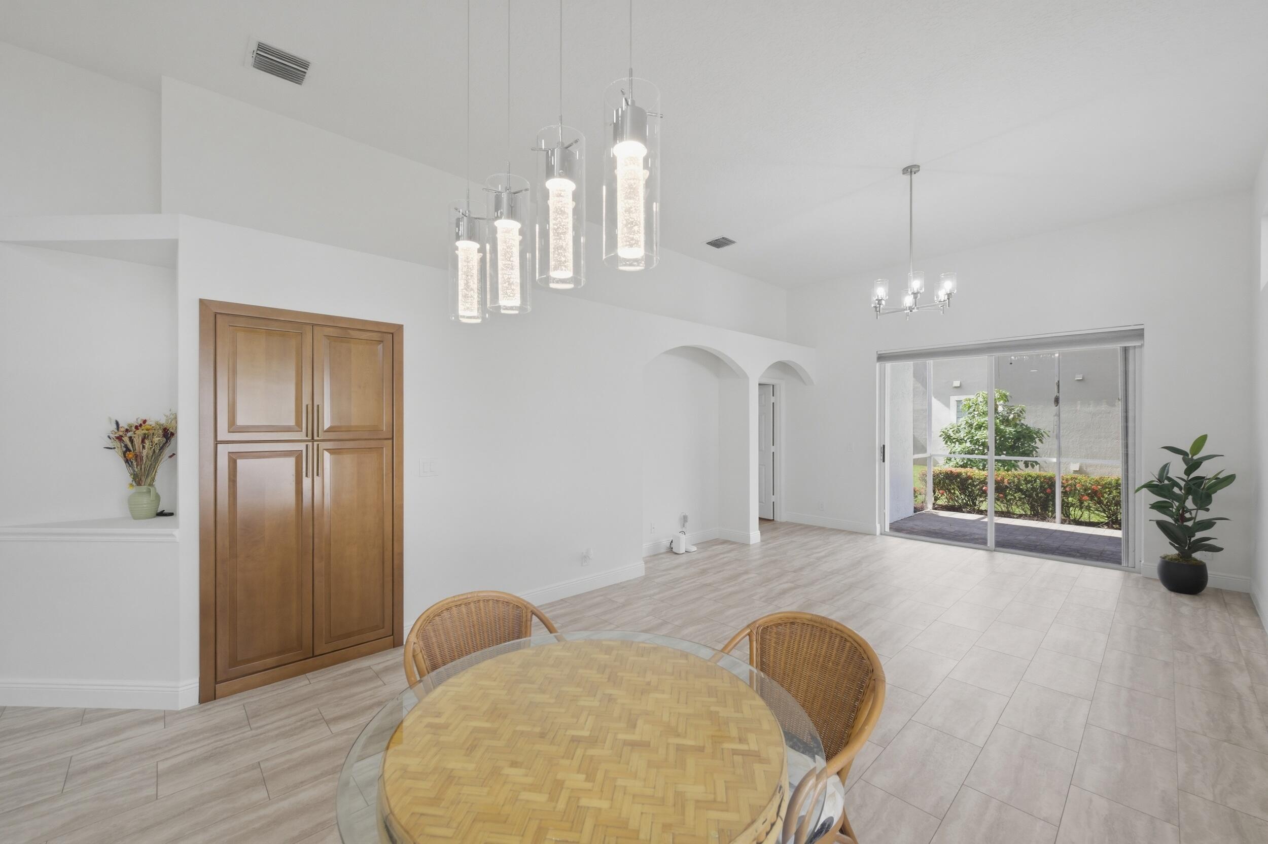 8534 Vía D Oro Boca Raton, FL 33433 - Photo 18 of 34 a view of kitchen with furniture and wooden floor